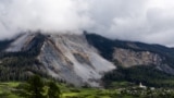 FILE PHOTO: Residents of a Swiss village Brienz evacuate due to risks of more rockslides